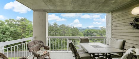 Easy Access - The living room provides quick and easy access to the patio where you can sit and enjoy the cool breeze while sharing stories and laughs with friends.