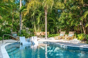 Lounge and dine by the pool