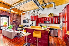 Studio loft with large window and lots of sunshine