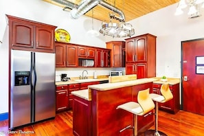 Kitchen with island and bar top