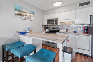 Seating for 3 at the breakfast bar