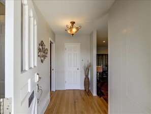 foyer leading into the large great living room and spacious kitchen