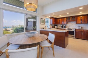 The newly remodeled kitchen and dining area comes complete with ocean views