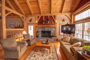 Cozy up to wood burning fireplace with 60' TV