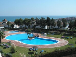 Pool. Tropical swimming pool with hydraulic launch seat for the disabled