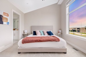 Explore the allure of our delightful master bedroom, graced with a luxurious King bed and a private ensuite bathroom for your ultimate comfort and convenience.