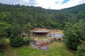 Enjoy the secluded "Bougie Bunker" located on a mountainside with amazing views, privacy, and a comfy/cozy interior that will have you wanting to come back over and over. Experience the WOW factor for yourself!