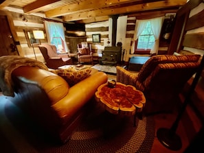 Living room with leather sofa and hand crafted live edge end tables