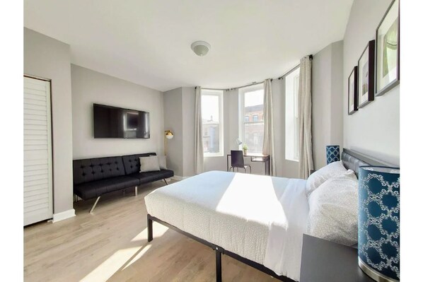 Bedroom #1 with full size bed and sofa bed, Roku TV and in-suite bathroom