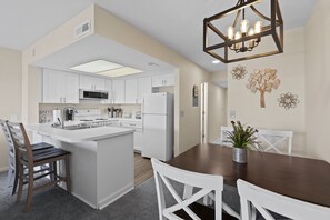 Dining table seats four and bar seating for 2