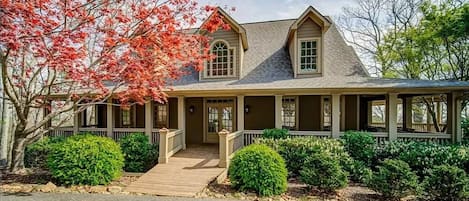 Front entryway with welcoming wraparound deck