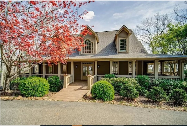 Front entryway with welcoming wraparound deck