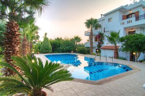 Pool. The pool area is surrounded by beautiful decorative plants and olive trees