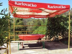 Terrace. table and benches under the shade on the terrace