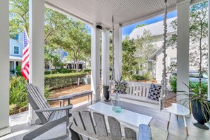 Covered front porch with relaxing seating set