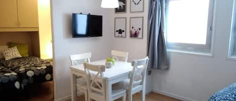 Living area. The dining table in the livingroom-kitchen