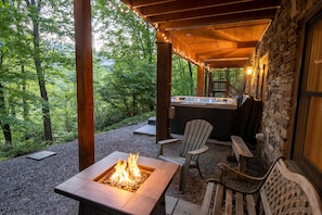 View of fire pit and hot tub area