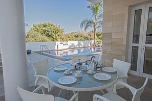 Outside seating area with table and chairs to seat 6