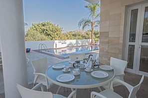 Outside seating area with table and chairs to seat 6