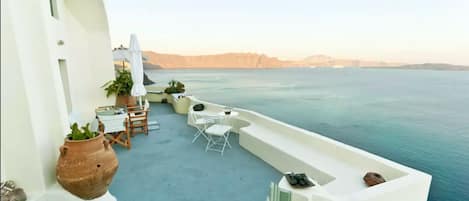 Our shared terrace has an amazing view to the sea and the volcano of Santorini