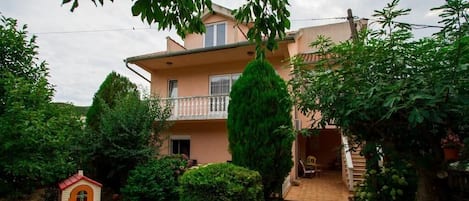 External view of the building. Front view of the house. Apartment is located on the first floor.