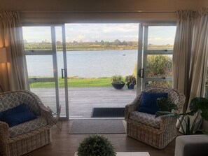 Water front house - lounge looking out to water 