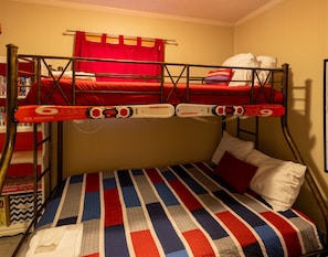 Third bedroom features a queen bunk bed