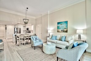 Another view of the open concept living room with a sleeper sofa