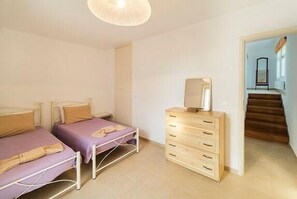 Sleeping area. Bedroom with two singled beds