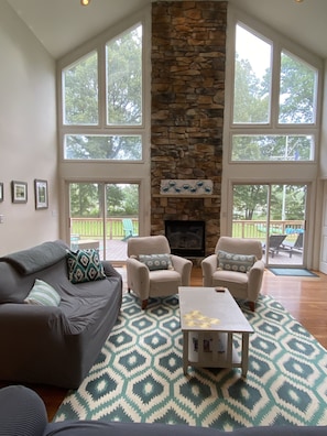 Large and bright great room with plenty of seating and amazing water views