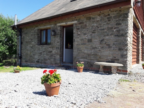 External view of the building. The Barn Annexe on a sunny day