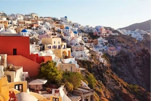 View of Oia traditional village from the window of the house