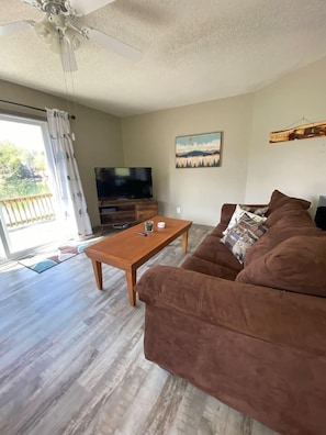 Living room with foldout couch and smart TV