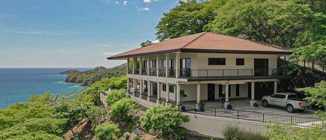 Casa Magnificent sits perched on the edge of the hillside overlooking Playas del Coco.  