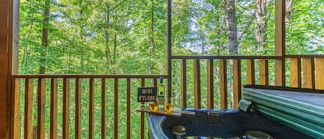 Relax among the trees in the Hot Tub!