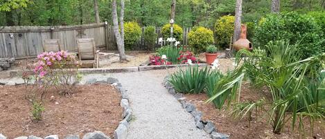 Beautiful, zen-like backyard with a fire pit, lg deck, and hot tub.