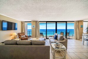 This unit offers 65 feet of floor-to-ceiling glass and views of the gulf from every room!