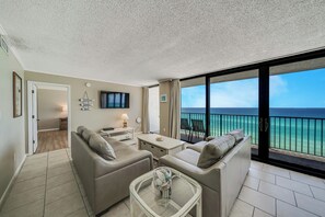 The living room offers ample, comfortable seating (brand new sofa & love seat fall of 2024!), a flat screen television, and incredible views.