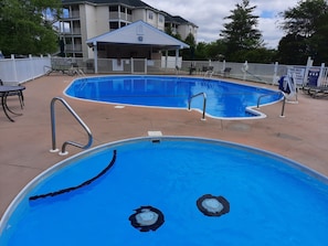 Large Outdoor Pool, Kids Pool, ample seating & covered patio!