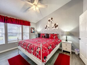 Charming Mickey Mouse bedroom with cozy bedding and playful decor.
