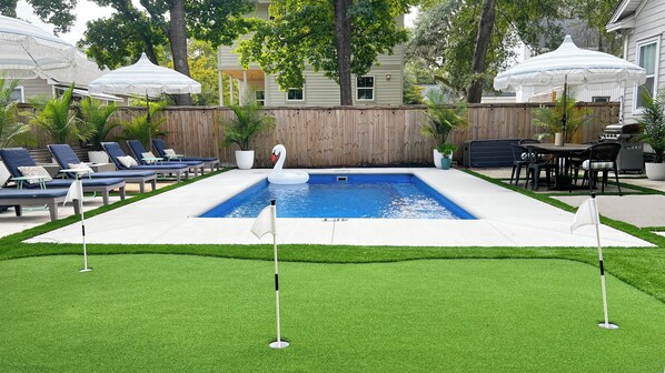 New salt water pool with heater/chiller, putting green, firepit, & grill