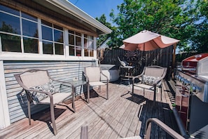 Large deck in the backyard with plenty of seating