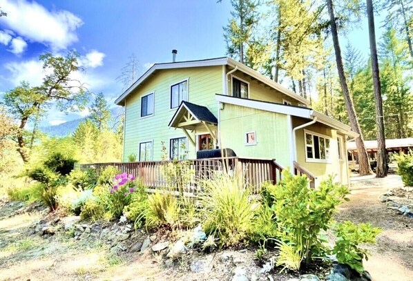 Entry to the home with access to a spacious deck