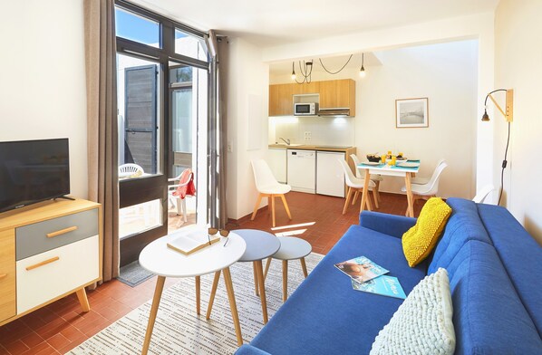 Kick back your feet and relax in the cozy living area. Please note that there is no terrace.