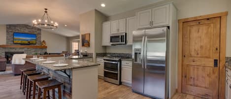 Kitchen area with stainless-steel appliances and spacious island