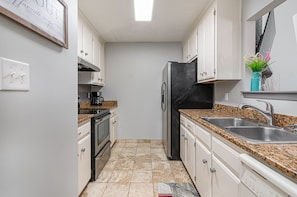 Fully stocked galley kitchen.