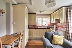 The open plan kitchen and dining area at Harcombe Cottage, Devon