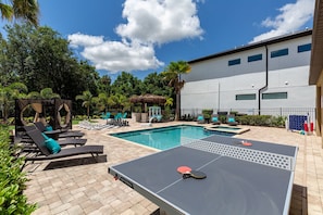 Play a round of table tennis outside by the pool