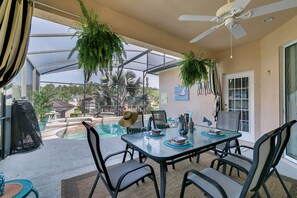 Fantastic outdoor dining area with fan and views over the pool