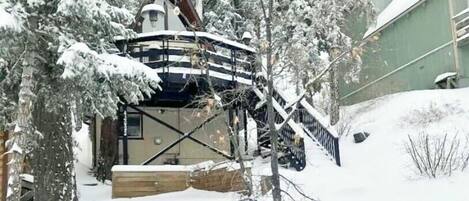 Snow covered Big Bear Cool Cabins, Bear Mountain Summit Lodge